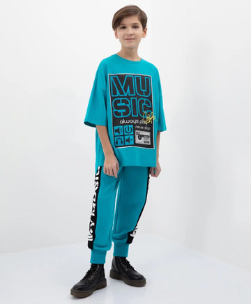 Pantaloni jogging turcoaz cu dungi și imprimeu Gulliver